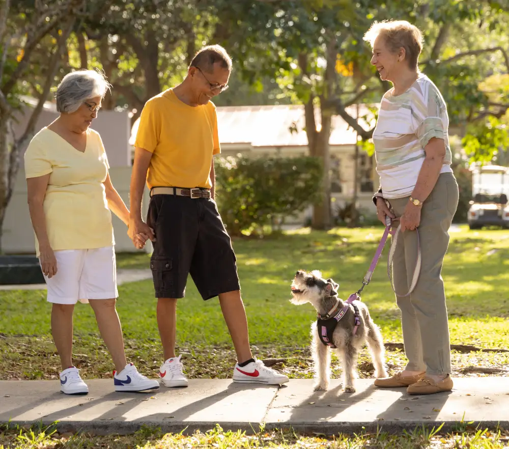 East Ridge at Cutler Bay senior residents walking their dog