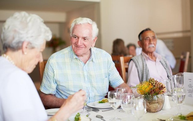 senior couples sitting down to enjoy brunch together