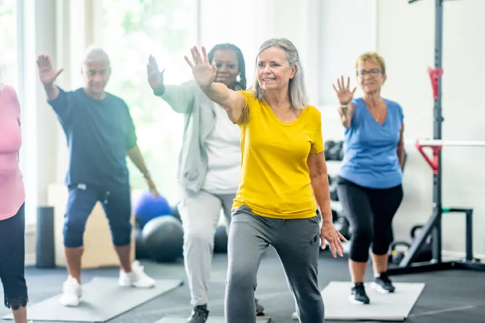 a group of seniors participating in a tai chi class